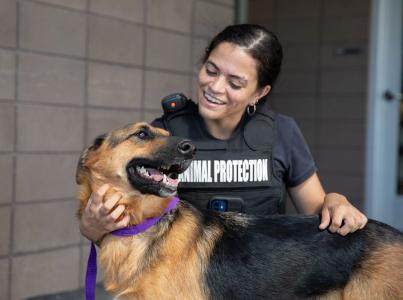 ACO smiling at a dog