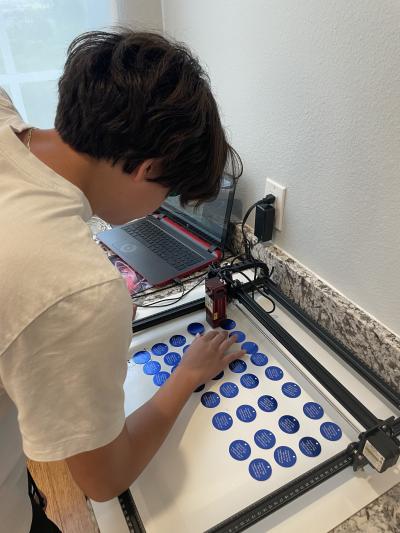 Kenny making tags